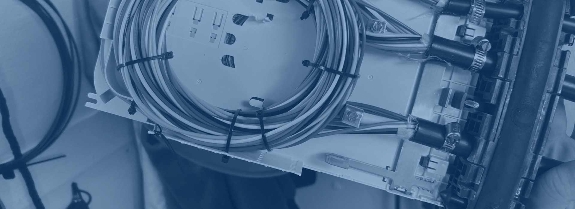 close up of cables tied in a box, tinted blue